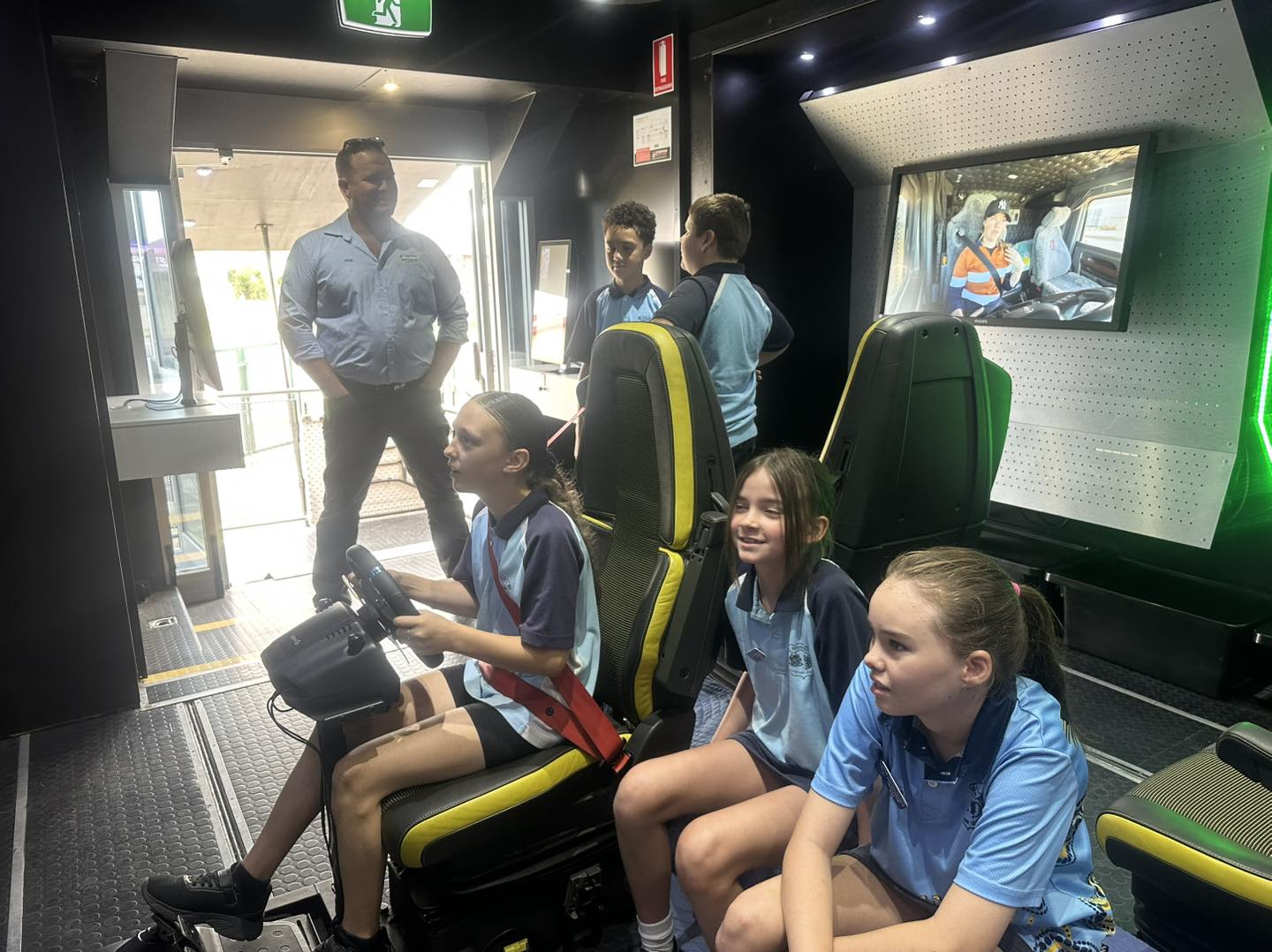 Students learning inside the roadshow trailer